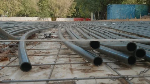 Panoramic view of balck tubes. Building of new skating rink with artificial ice Stock Footage 120507778