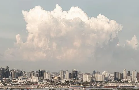 Panoramic view of Bangkok skyline with a dramatic, massive white cloud form.. Stock Photos