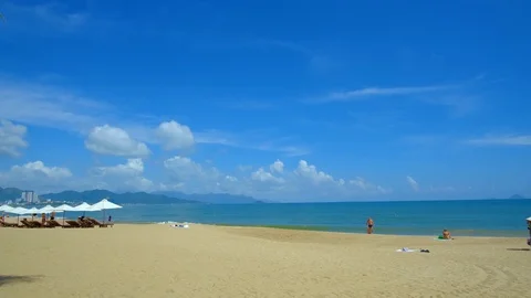 Panoramic view beach, chairs and umbrellas. Nha Trang city, Vietnam Stock Footage 101351498