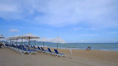 Panoramic view beach, chairs and umbrellas. Nha Trang city, Vietnam Stock Footage 101420266