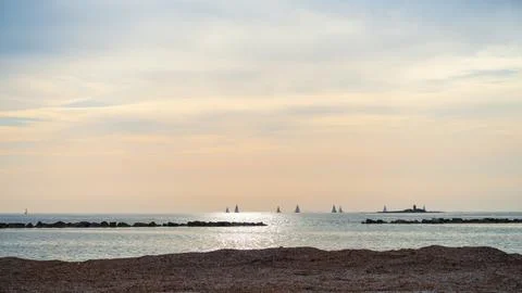 Panoramic view of the beach at sunset in Alghero, Sardinia, Italy Stock Photos