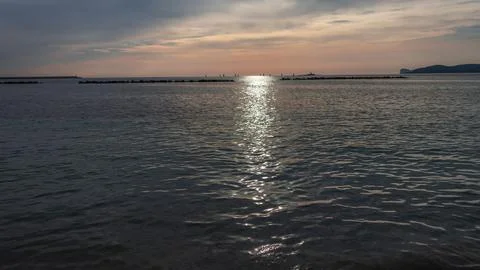 Panoramic view of the beach at sunset in Alghero, Sardinia, Italy Stock Photos