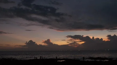 A panoramic view of the beach at sunset. Silhouettes of people taking commemorat Stock Footage 115634709