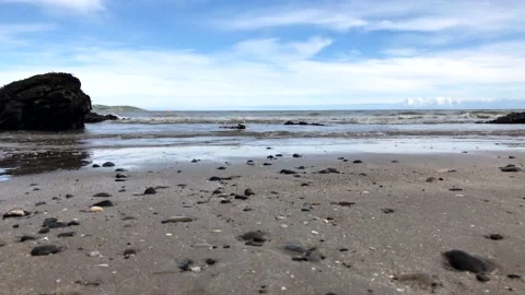 Panoramic view of the beautiful rocky beach with waves	 Stock Footage 149321670