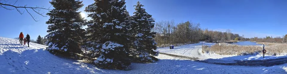 Panoramic view of the beautiful snow-covered slope in the public park Stock Photos