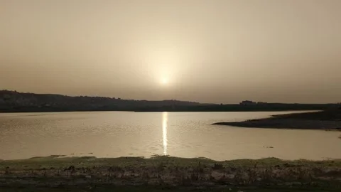 Panoramic view of beautiful sunset or dawn over the pond or lake in spring Видео 241367430