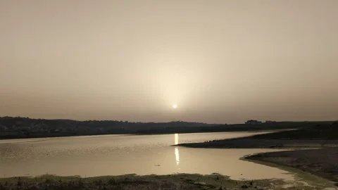 Panoramic view of beautiful sunset over the lake in spring Видео 241366577