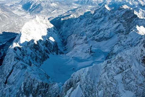 Panoramic view of beautiful winter mountain scenery in the Alps in sun light. Stock Photos