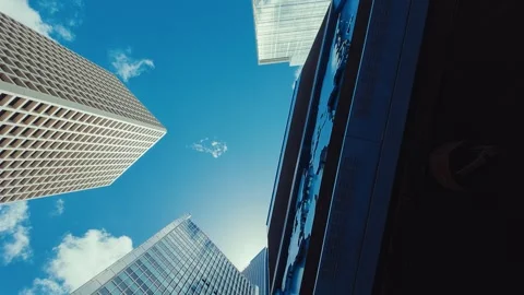 A panoramic view from below looking up at modern skyscrapers in Hong Kong's Video stock 338311512