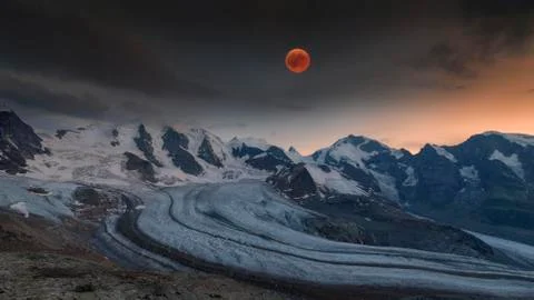 Panoramic view of the Bernina Group with blood moon Piz Palue Bellavista Crast Stock Photos