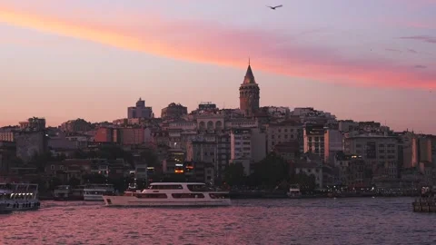 Panoramic view of the Beyoglu district with illuminated Galata Tower at sunset Stock Footage 248212599