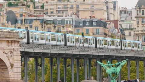 Panoramic view of the Bir-Hakeim Bridge in Paris with a metro train crossing Stock Footage 329503705