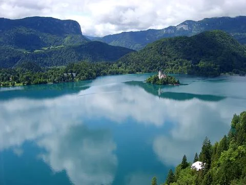 Panoramic view of Bled Lake with Pilgrimage Church of the Assumption of Maria Stock Photos