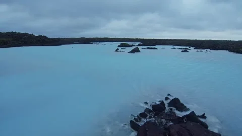 Panoramic View of Blue Lagoon, Iceland with Geothermal Water and Volcanic Rocks Stock Footage 320516143