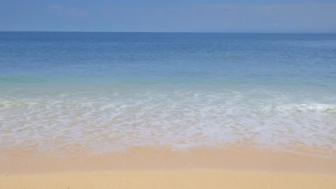 Panoramic view of blue ocean with big warm waves and splashes from sandy beach Video stock 115025338
