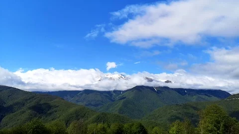 Panoramic view of the blue sky, white clouds and mountains Stock Footage 109335160