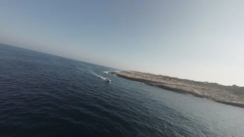 Panoramic view of a boat floating in the sea captured by FPV drone RAW video Stock Footage 248691412