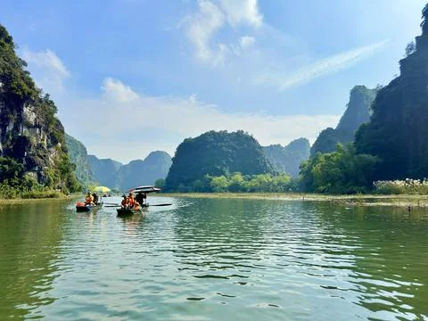 Panoramic view of boat wharf and mountains in Tam Coc, Ninh Binh from afar. Stock Photos