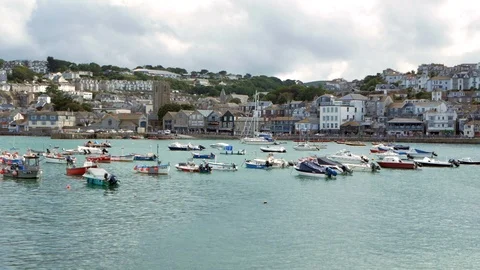 Panoramic view of boats floating on the bay and town in background Stock Footage 112698029