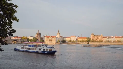 Panoramic view on boats on Vltava River and Old Town in Prague / 4K Video Stock-Footage 97942591