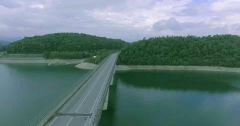 Panoramic view of the bridge connects two banks, in the background a seashore Stock Footage 73642140