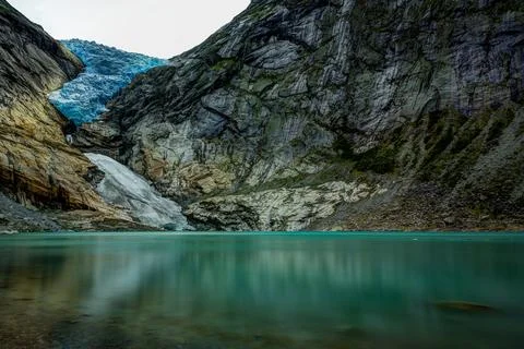 Panoramic view of the Briksdalsbreen glacier with Briksdalsvatn meltwater l.. Stock Photos