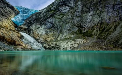 Panoramic view of the Briksdalsbreen glacier with Briksdalsvatn meltwater l.. Stock Photos