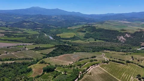 Panoramic View of Broad Tuscan Valley and River Basin Under Blue Sky Stock Footage 345782310