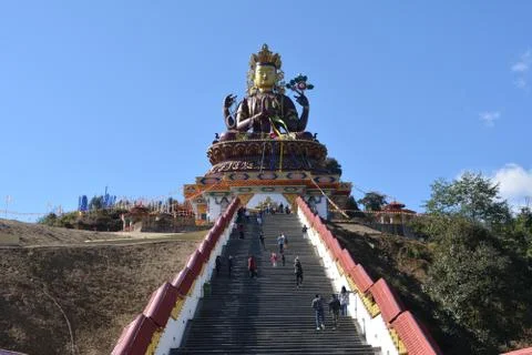 Panoramic view of Buddha statue atop a mountain taken from ground Stock Photos