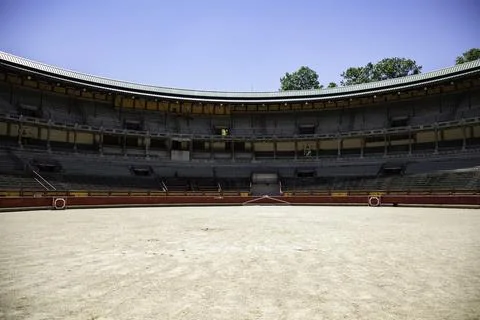 Panoramic view of a bullring from inside on a clear sunny day Stock Photos
