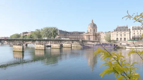Panoramic view of the calm Seine River and Pont des Arts footbridge Video stock 335131142