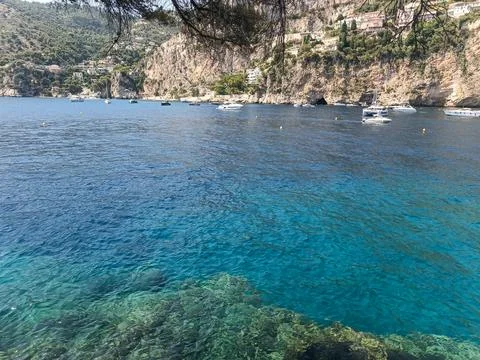 Panoramic view of Cap d'Ail bay filled with anchored luxury yachts Stockfoto's