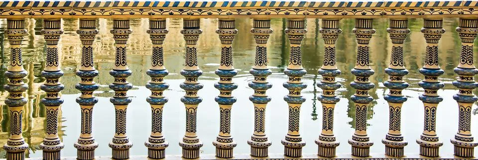 Panoramic view of carved stone balcony balustrade of ancient palace Stock Photos