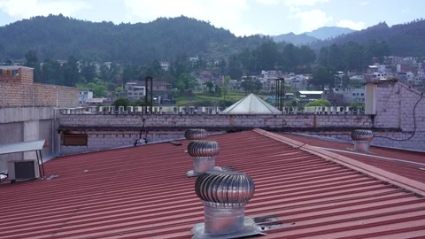 Panoramic view of ceiling fans in a mountainous village Stock Footage 287660398