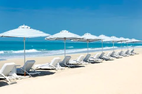 Panoramic view of chairs on the beach Stock Photos