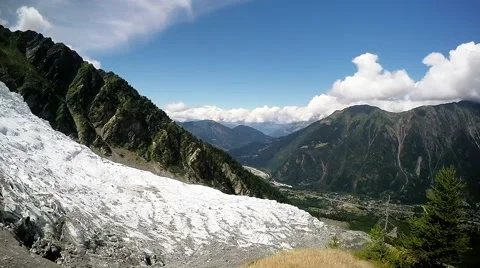 Panoramic view of Chamonix valley and alpine glacier with mountain meadow Stock Footage 53246964