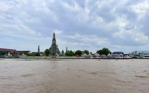 Panoramic view of Chao Phraya River and Wat Arun temple under fluffy white Stock Photos