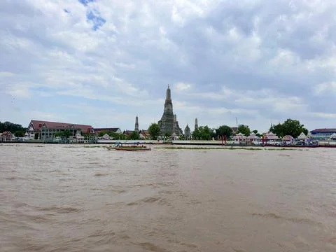 Panoramic view of Chao Phraya River and Wat Arun temple under fluffy white Stock Photos