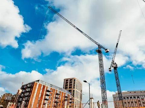 Panoramic view of city construction on blue sky background Stock Photos