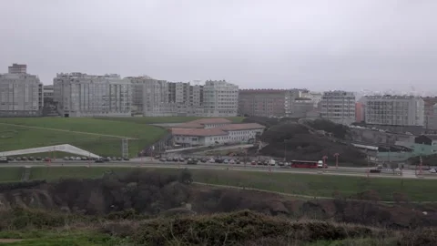 Panoramic view of the city of La Coruna a in the fog, public transport bus rides Stock Footage 240849272