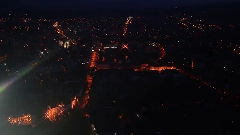 Panoramic view of a city lit only by street lighting poles and cars ci Stock Footage 70698148