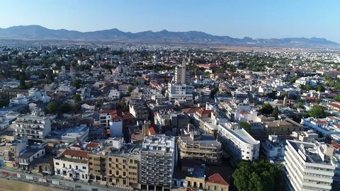 Panoramic view of city with mountain landscape in the background. Stock Footage 78355887