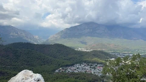 Panoramic view of the city on the seashore and the mountain range in the Stock Footage 308316637