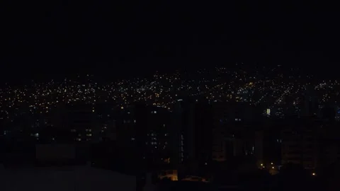 Panoramic View of City Skyline and Hills at Night Vídeos de archivo 310335282