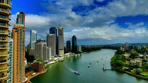 Panoramic View of City Skyline with River and Blue Sky Stock Footage 310706729