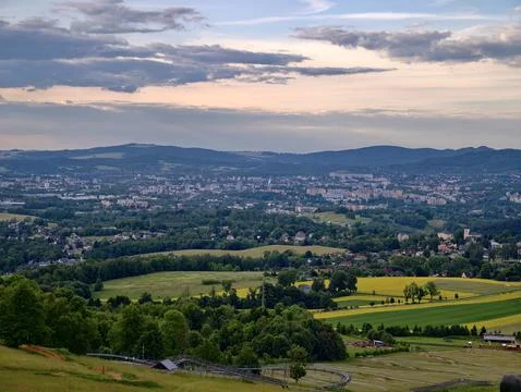 Panoramic view of a city valley with fields and hills Stock Photos