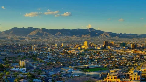 Panoramic View of Cityscape at Sunset with Mountain Range Background Stock-Footage 310705837