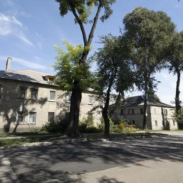 Panoramic view of a classic two-story yellow brick residential building on a  스톡 사진