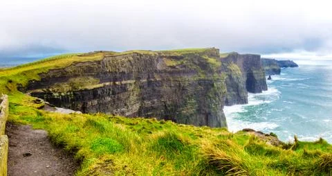 Panoramic view of the Cliff of Moher in a cloudy wintery day, Ireland Stock Photos