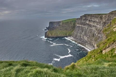 Panoramic view of the Cliffs of Moher, Ireland. Cliffs of Moher during sunset Stock Photos